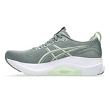 Women's ASICS GEL-Kayano 32 stability trainers in Monument Blue and Whisper Green, featuring supportive cushioning and sporty design.