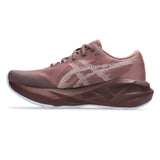 Womens ASICS Novablast 5 TR trail running shoes in Rubble Red with a breathable mesh upper and durable rubber outsole.