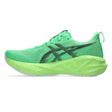 Women's ASICS Novablast 5 neutral daily trainers in vibrant green and black with breathable mesh upper and cushioned sole.