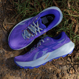 Womens ASICS Trabuco 14 trail running shoes in amethyst and cobalt with sturdy outsole and breathable mesh upper.