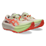 Women's ASICS Trabuco Max 5 trail running shoes in rose dust and sun coral with breathable mesh and rugged outsole.
