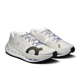 Men's On Cloudultra Pro trail running shoes in black and orange with durable soles and supportive design.