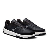On THE ROGER Clubhouse men's tennis shoes in white and blue with a sleek design and cushioned sole for comfort and support.