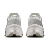 Women's On Cloudmonster 3 road running shoes in black and pink with cushioned soles and breathable mesh upper.