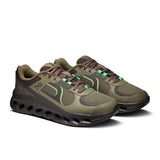 Men's On Cloudtilt Arc active lifestyle shoes in black with white accents, showing the side view and breathable mesh upper.