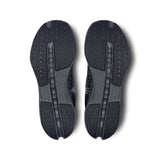 Men's On Cloudsurfer Next road running shoes in gray with blue accents, featuring lightweight cushioning and breathable mesh uppers.