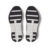 Men's On Cloudtilt active life sneakers in black and gray with cushioned soles and sleek design, suitable for everyday active wear.