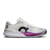 On THE ROGER Pro 3 women's tennis shoes in white with black accents, featuring a sleek design and cushioned soles.