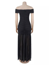 Off-shoulder ruched mermaid maxi dress by Trendsi, featuring a fitted bodice and flowing skirt with elegant ruffle details.