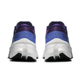 Women's On Cloudmonster 3 road running shoes in black and gray with cushioned soles and breathable mesh upper.