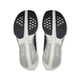 Women's On Cloudboom Strike road running shoes in black with white accents, featuring lightweight design and cushioned soles.