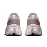 Women’s On Cloudmonster 3 road running shoes with lightweight design and cushioned soles, shown in a sleek athletic style.