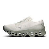 Women's On Cloudmonster 3 road running shoe with cushioned white and blue design, featuring breathable mesh upper and durable outsole.