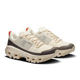 Women's On Cloudrock Low Waterproof hiking shoes with durable black and gray design, featuring waterproof material and supportive soles.