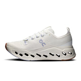 Women's On Cloudsurfer Max road running shoes in Ivory and Nimbus from the Classic Collection, featuring breathable mesh and cushioned soles.