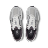 Women's On Cloudsurfer Next road running shoes with sleek design and breathable mesh in black and white.