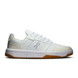 On THE ROGER Clubhouse men's tennis shoes in white with blue accents, featuring breathable mesh and supportive rubber soles.