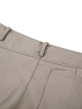 Men's high-waisted wide-leg pleated casual pants in neutral fabric, styled for a relaxed, fashionable look.