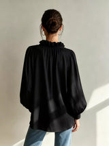 Trendsi frill notched long sleeve blouse featuring ruffled shoulders and a classic collar, stylish and feminine for casual or office wear.