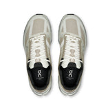 Men's On Cloudsurfer Next road running shoes in black and gray, featuring lightweight design and cushioned sole for comfort.