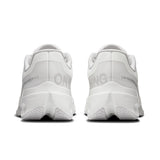 Women's On Cloudsurfer Next road running shoes in black and pink with cushioned soles and breathable mesh upper.
