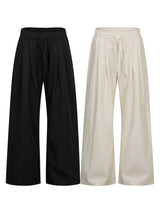 Men's wide-leg drawstring pants from Trendsi, showing relaxed fit and comfortable waistband, in a neutral fabric.