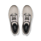 Women's On Cloudmonster 3 road running shoes with gray and blue design, featuring cushioned midsoles and durable rubber outsoles.