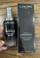 Lancôme Advanced Génifique Youth Activating Concentrate serum bottle, 100ml, with sleek design and pump dispenser, on a white background.