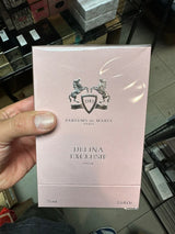 Delina Exclusif fragrance by Parfums De Marly in 75ml Eau De Parfums bottle, elegant glass bottle with gold accents.