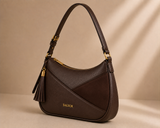 Brown Bagsor shoulder bag with curved design and tassel detail, featuring a stylish and spacious interior.
