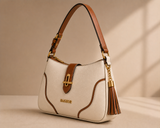 Cream and tan two-tone shoulder bag with tassel detail by Bagsor, featuring a stylish design and adjustable strap.