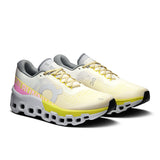 Women's On Cloudmonster 2 road running shoes in ivory and lime, featuring a sleek design and supportive cushioning.