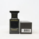 Tom Ford Oud Wood unisex Eau de Parfum bottle with sleek design and gold accents, showcasing the luxurious fragrance packaging.