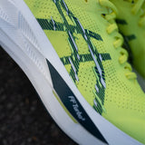 Men's ASICS Sonicblast tempo trainers in black with white accents, featuring lightweight mesh and cushioned soles.