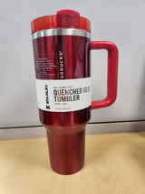 Stanley Quencher H2.0 FlowState 40 oz tumbler in stainless steel with lid, designed for hot and cold beverages.