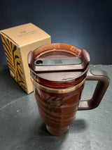 Stanley x Messi limited edition 40 oz stainless steel vacuum insulated tumbler with handle and straw for beverages.