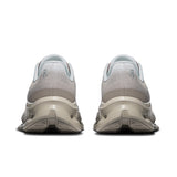 Women's On Cloudtilt active life sneakers with gray and black design, lightweight running shoes by On, suitable for active lifestyles.