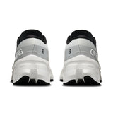 On Cloudmonster 3 women's road running shoes in black and pink, featuring breathable mesh and cushioned sole for comfort.