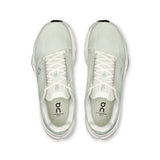 Women's On Cloudsurfer Next road running shoes with cushioned design and breathable mesh in black and white.