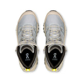 Women’s On Cloudrock Mid Waterproof hiking boots in black and gray with rugged soles and supportive ankle design.