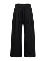 Men's wide-leg drawstring pants by Trendsi, shown in a relaxed fit with adjustable waist and casual style.