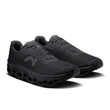 Men's On Cloudmonster Void active life sneaker in black with white accents, showcasing its lightweight, cushioned running shoe design.