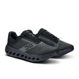 Men's On Cloudsurfer Next road running shoes in gray with white accents, featuring cushioned soles and breathable mesh uppers.