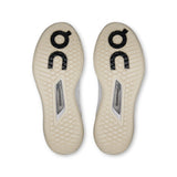 On THE ROGER Pro 3 women's tennis shoes in black and white with cushioned sole and supportive design.