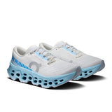 Women's On Cloudmonster 3 road running shoes with breathable mesh upper and cushioned sole, designed for comfort and performance.