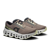 Women's On Cloudmonster 3 road running shoes with cushioned soles and breathable mesh upper, designed for comfort and performance.