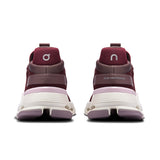 Women's On Cloudnova 2 active lifestyle sneakers in black with cushioned soles and breathable mesh upper.
