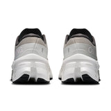 Women's On Cloudmonster 3 road running shoes with breathable mesh and cushioned sole, designed for comfort and performance.