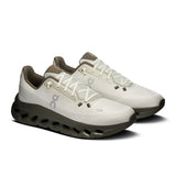 On Cloudtilt men's active life shoes in black with white accents, showcasing the sleek design and breathable mesh upper.