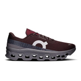 Men's On Cloudmonster 1 active life sneaker in black and gray with cushioned sole and breathable mesh upper.